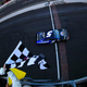 Kasey Kahne takes the checkered and yellow flag at the same time to win the Brickyard 400, because everything is terrible and races shouldn’t finish under green. Photo credit: Dan Shirey/Getty Images